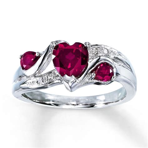 Kay jewelers ruby ring - The ring is fashioned in 10K rose gold and has a total diamond weight of 1/8 carat. Item #: 135126908. Content & Care. Ruby is commonly subject to enhancement processes or treatments such as heating, diffusion and filling, which may not be permanent and may require special care. Gently clean by rinsing in warm water and drying with a soft cloth. 